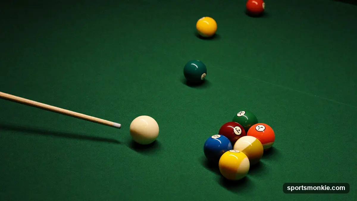 A snooker table mid-frame with reds racked and the coloured balls on their spots