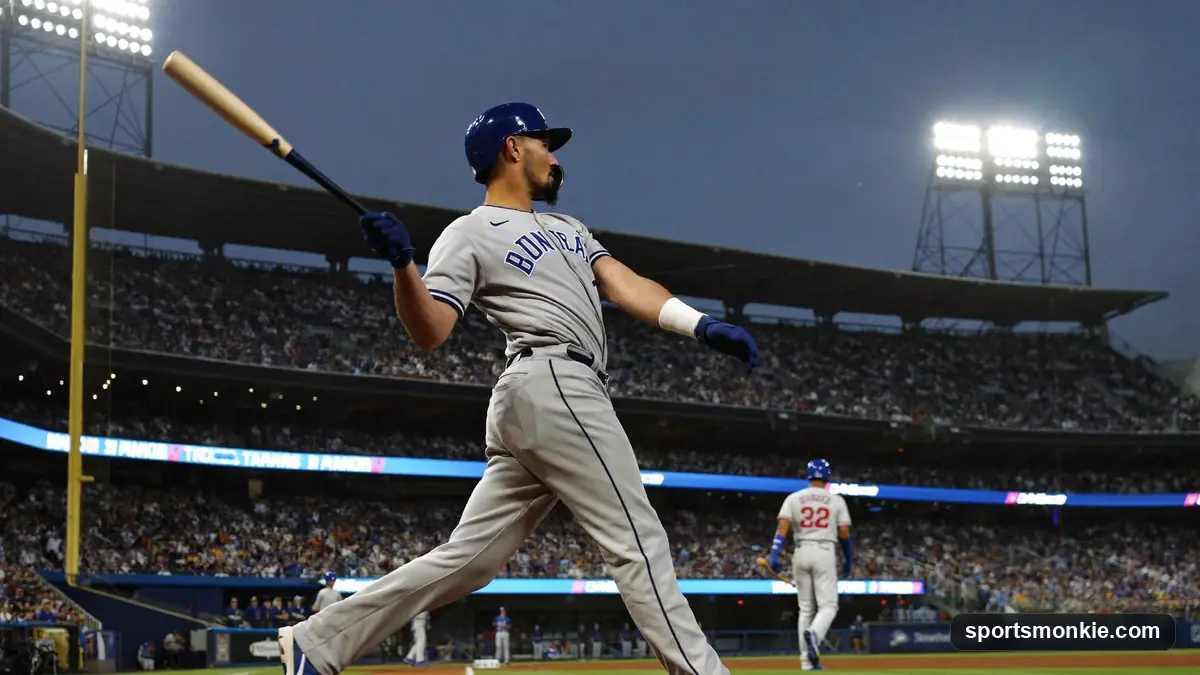 MLB batter making contact at home plate under stadium lights