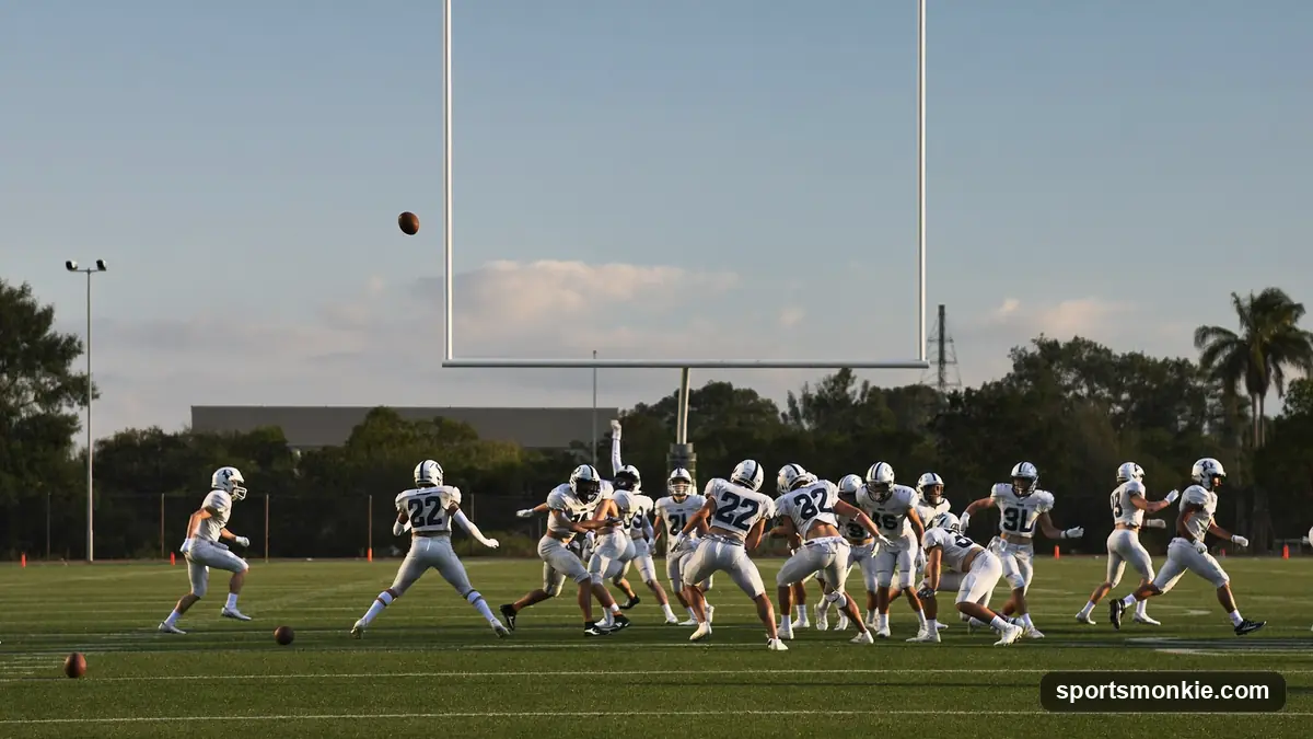 Youth flag football players spread across a field during a pass-focused 7-on-7 game