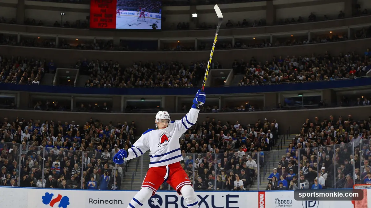 NHL forward celebrating a goal as the crowd rises behind the glass