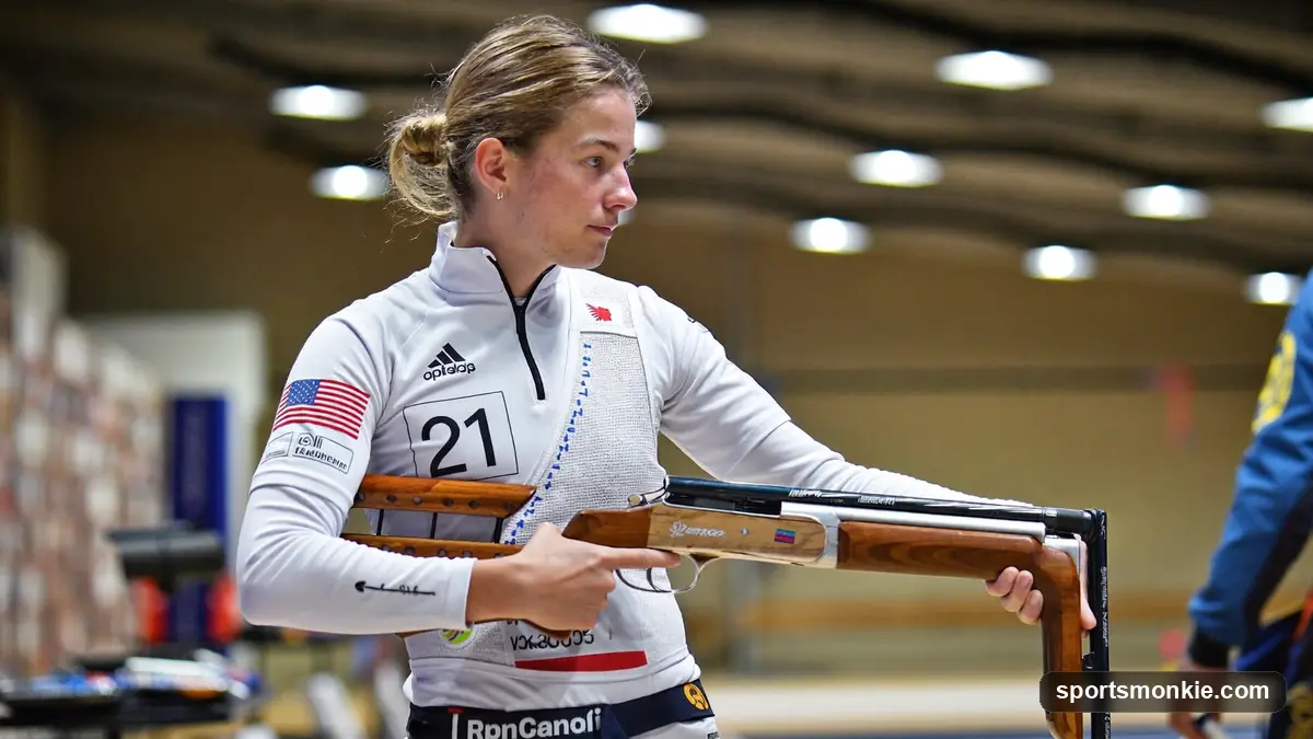 An Olympic shooter in a rifle jacket taking aim down a 10 metre air rifle range