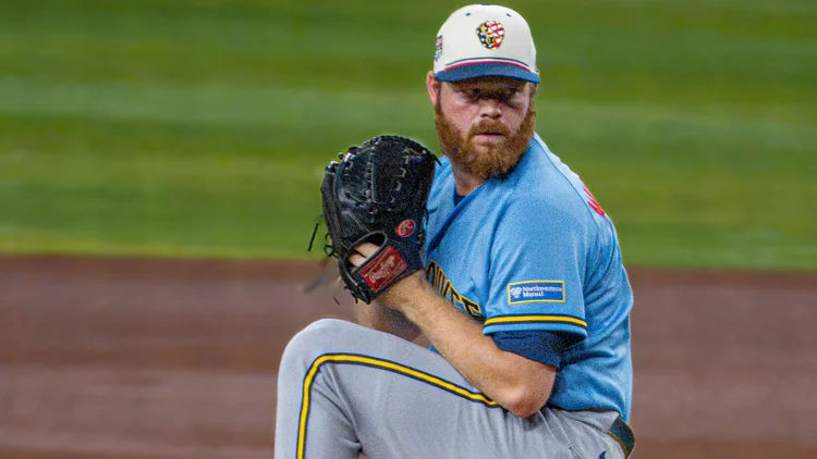 File photo: Brandon Woodruff winding up for the Brewers on July 4, 2026, the last game he pitched before the shoulder injury. He has not appeared in a game since.