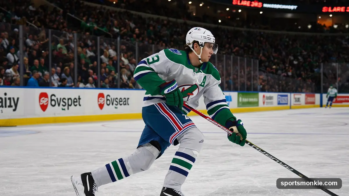 NHL player skating with the puck under arena lights