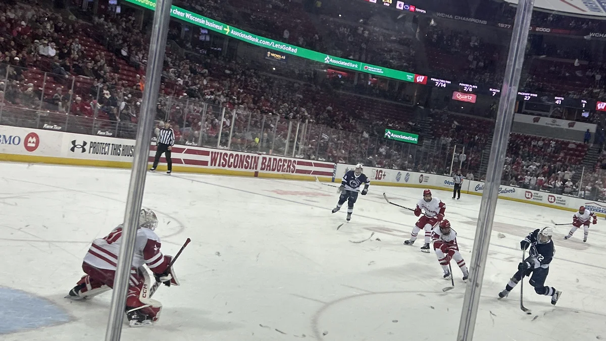File photo from January 2026 of Gavin McKenna playing for Penn State against Wisconsin at the Kohl Center, shooting on goal as he completes his first collegiate hat trick. It does not show Monday's Maple Leafs game against San Jose. The 16:9 cropped derivative is offered under the same CC BY-SA 4.0 licence.