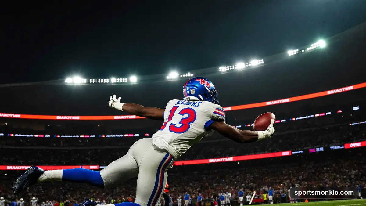 NFL wide receiver making a leaping catch downfield in front of a defender