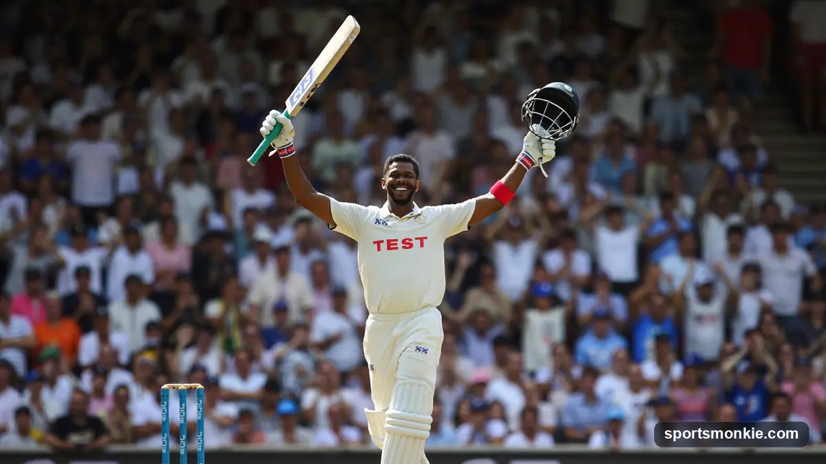 Batter raising his bat to celebrate a Test century