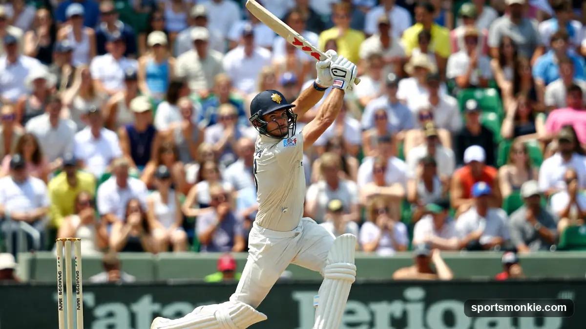 Cricket bat and ball resting on a Test match pitch