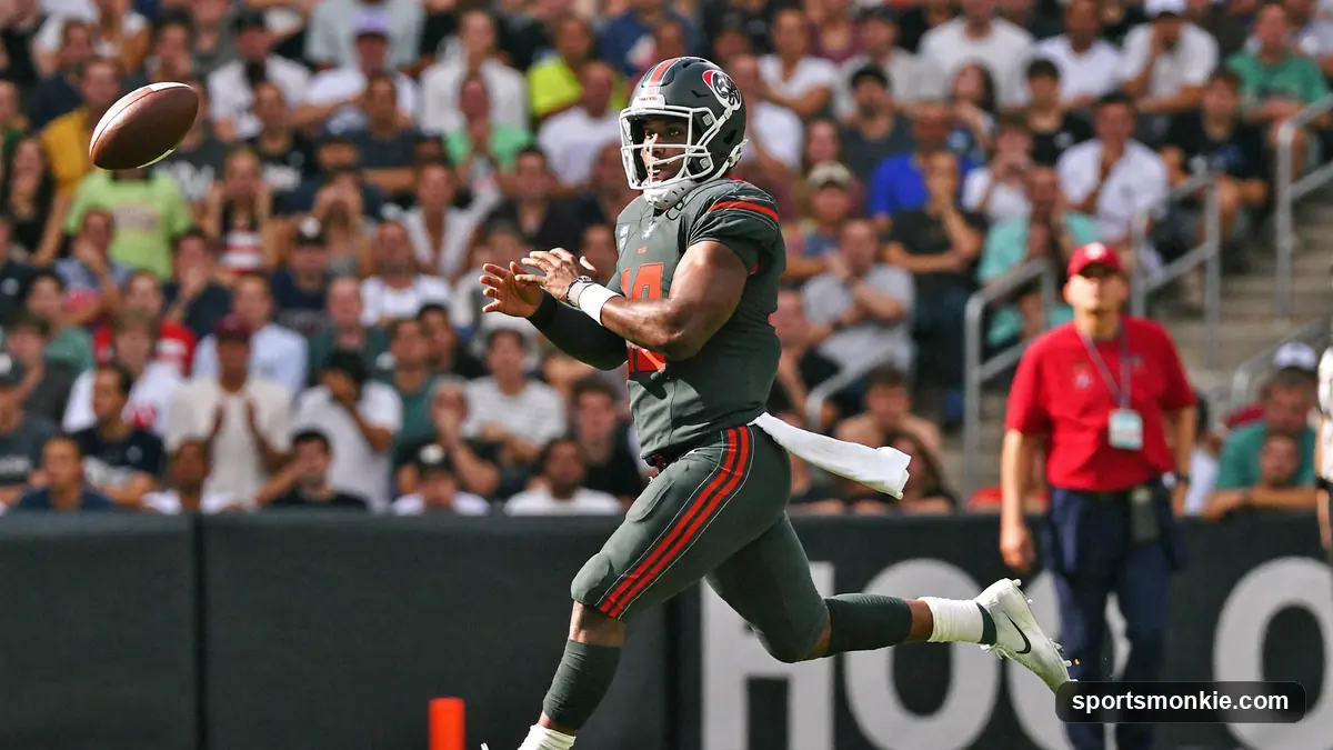 NFL quarterback dropping back to pass under stadium lights