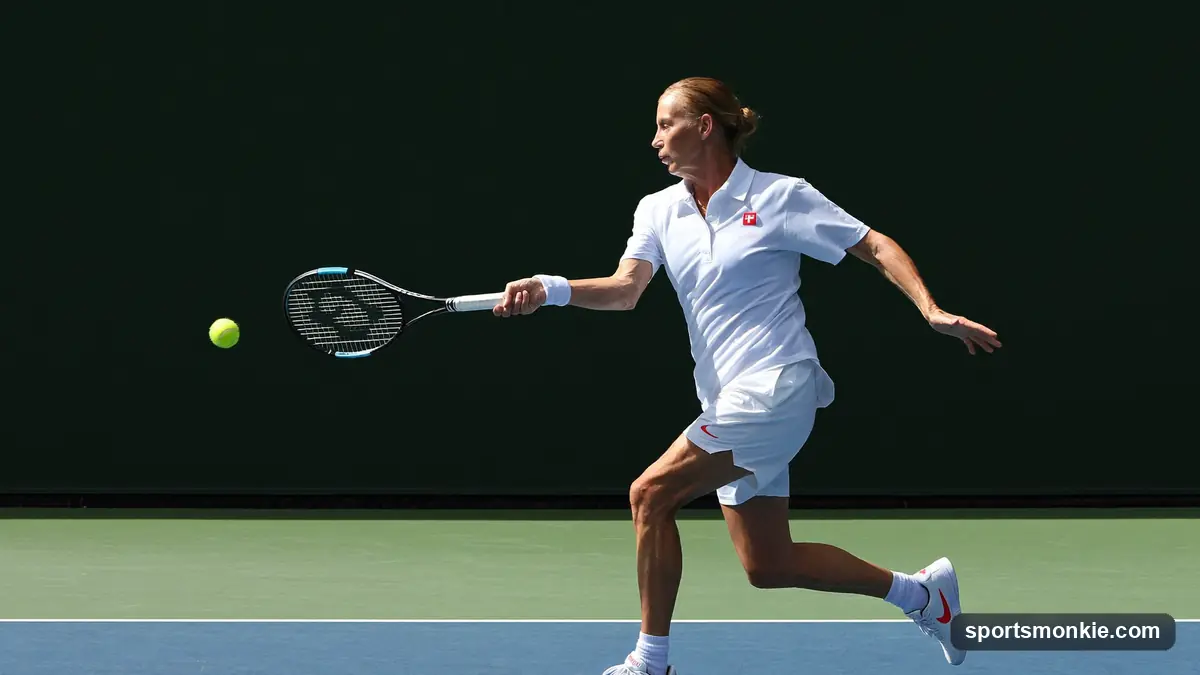 Tennis racket and ball on a clay court beside the baseline