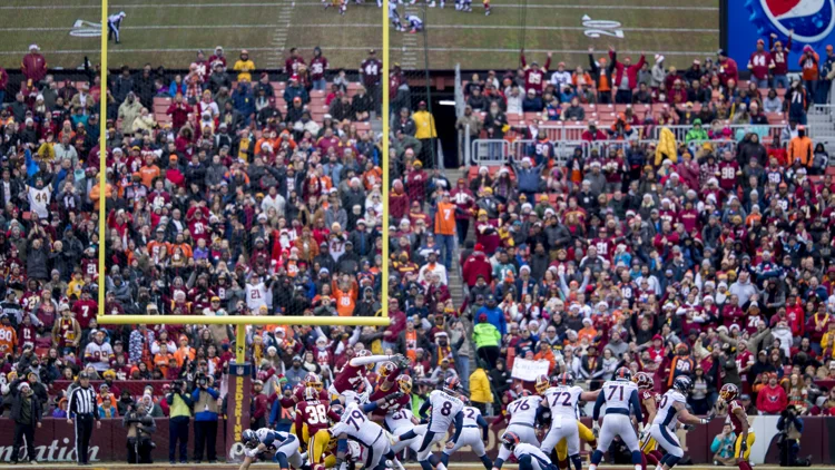 File photo from December 24, 2017: Brandon McManus, wearing number 8, kicking for the Denver Broncos at Washington, seen through the goalposts. It is a file photo from his Broncos years and does not show the Rams or his signing. The 16:9 cropped derivative is offered under the same CC BY-SA 2.0 licence as the original.