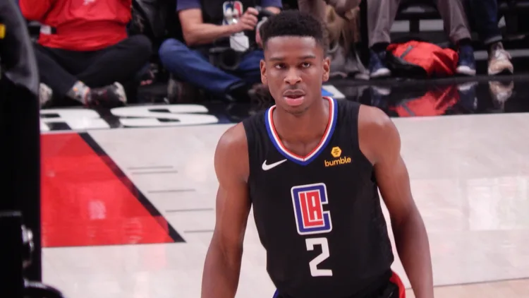 File photo from November 8, 2018: a young Shai Gilgeous-Alexander in a Los Angeles Clippers uniform against Portland at Moda Center. It does not show Tuesday's pre-season game against Indiana. The cropped 16:9 derivative is offered under the same CC BY-SA 4.0 licence as the original.
