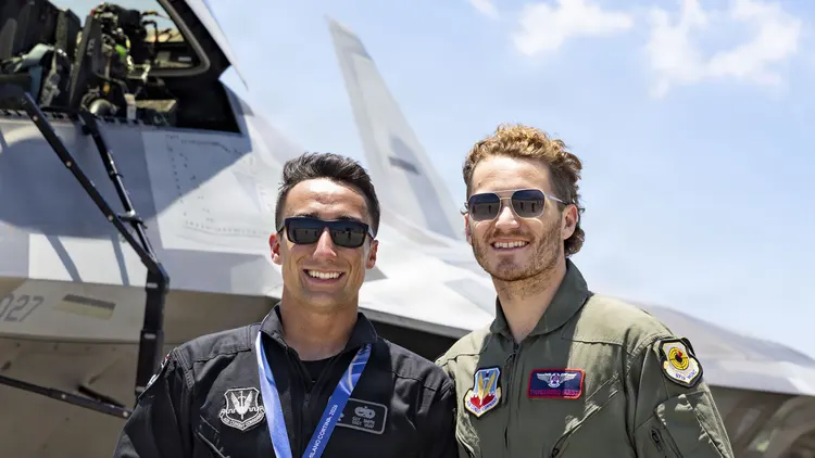 File photo of Matthew Tkachuk (right, sunglasses) with U.S. Air Force Staff Sgt. Guy Smith beside an F-22 in Fort Lauderdale in May 2026. It is not from Wednesday's game in Ottawa.