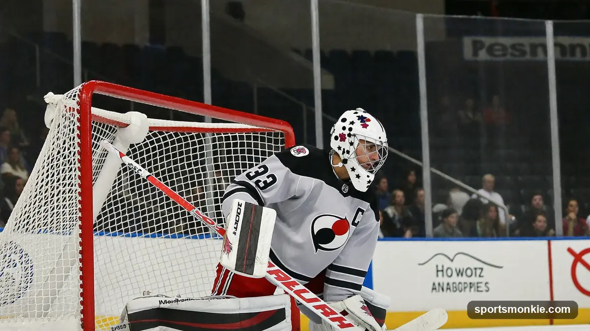 Goaltender's mask and pads beside an NHL trophy on the ice