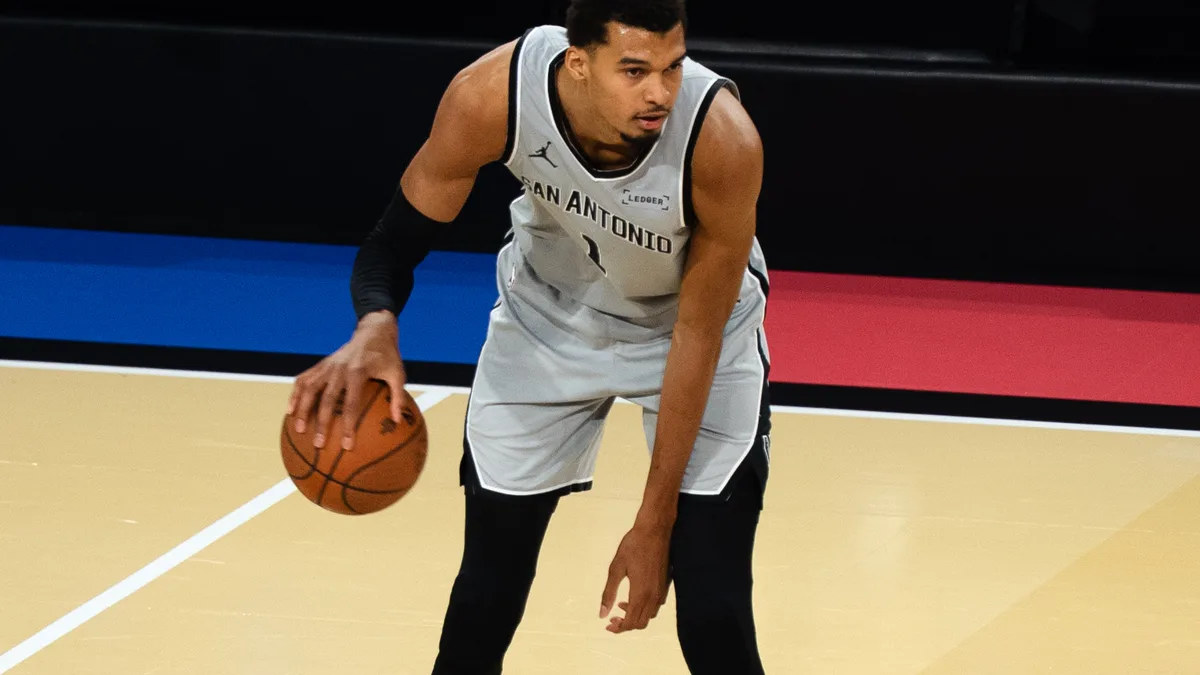 File photo from December 14, 2025: Victor Wembanyama dribbling in a San Antonio Spurs uniform at the NBA Cup. It does not show the preseason game against Sacramento. The 16:9 cropped derivative is offered under the same CC BY 4.0 licence as the original.