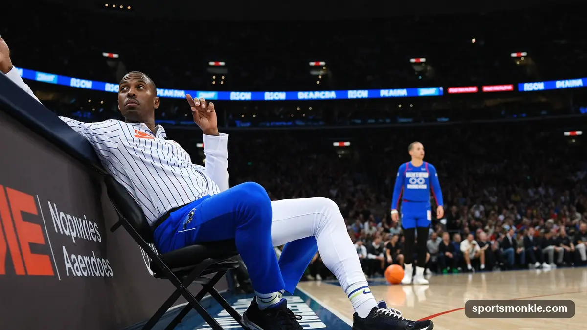 Basketball coach directing players from the sideline during an NBA game