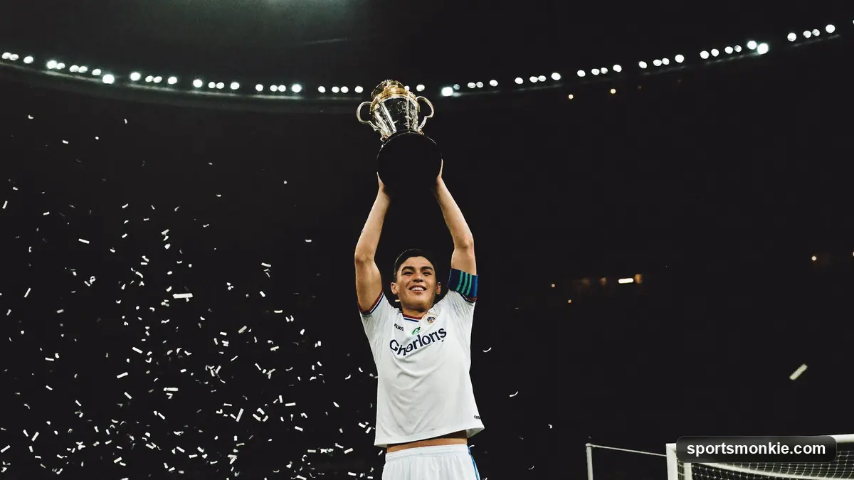 Young footballer lifting the golden Ballon d'Or trophy
